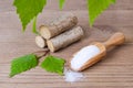 Sugar substitute xylitol, scoop with birch sugar, liefs and wood