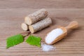 Sugar substitute xylitol, scoop with birch sugar, liefs and wood