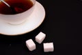 Sugar with tea in a white cup Royalty Free Stock Photo