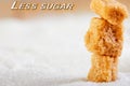 Less sugar text. Cubes of yellow sugar lying on a background of white sugar. Diet and health concepts