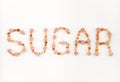 SUGAR written with brown sugar pieces