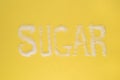 Sugar written on yellow background