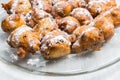 Sugared fryed fritters with raisins on glass scale Royalty Free Stock Photo