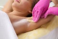 Sugaring: epilation with liquate sugar at armpit.