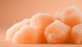 Sugary peach fuzz color jelly candies on soft minimal background. Modern trendy tone hue shade