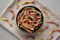 Sugary Sour Gummy Worms in a Bowl, top view Royalty Free Stock Photo