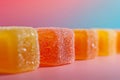 Sugary sour jelly candies lined up on a vibrant background
