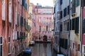 suggestive view with the houses on the navigable canal and the boats of the island of Venice in Italy