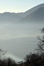 An suggestive view of Lake Iseo at sunset with the fog Royalty Free Stock Photo