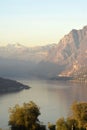 An suggestive view of Lake Iseo at sunset with the fog Royalty Free Stock Photo