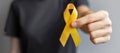 Suicide prevention day, Sarcoma, bone, bladder and Childhood cancer Awareness month, Yellow Ribbon for supporting people living Royalty Free Stock Photo
