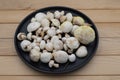 Fresh forest Suillus mushrooms on black plate, rustic food background. Royalty Free Stock Photo