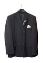 Suit jacket hanging on a hanger with a boutonniere