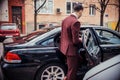 Suit man enters in a business limo Royalty Free Stock Photo