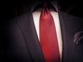 Suit and red tie