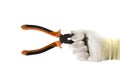 Orange and black flat-nose pliers in the hand in white glove isolated on white background Royalty Free Stock Photo