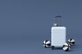 Suitcase with beach ball and flip flops on black and white background. Royalty Free Stock Photo