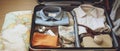 Suitcase With Clothes and Map, Perfect Travel Essentials for Adventurers Royalty Free Stock Photo