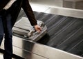 Suitcase on conveyor belt Royalty Free Stock Photo