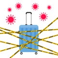 Suitcase crossed with a yellow striped ribbon. Cancellation of travel, flights, voyages and vacations due quarantine