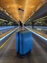 Suitcase on Escalator at airport terminal Royalty Free Stock Photo