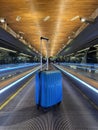 Suitcase on Escalator at airport terminal Royalty Free Stock Photo