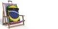 Suitcase with flag of Brazil with sunglasses on a beach chair. Vacation concept, 3d rendering Royalty Free Stock Photo