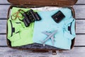 Suitcase with folded clothes and accessories. Royalty Free Stock Photo