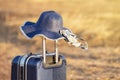 Suitcase and hat with background sunset Royalty Free Stock Photo