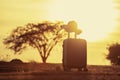 Suitcase and hat with background sunset Royalty Free Stock Photo