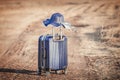 Suitcase and hat with background sunset Royalty Free Stock Photo