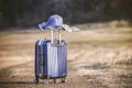 Suitcase and hat with background sunset Royalty Free Stock Photo