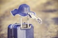 Suitcase and hat with background sunset Royalty Free Stock Photo