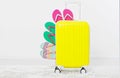 Suitcase isolated on white background Summer holidays. summer flip flops or slippers.Sandals beach.Red cap.Travel valise or bag. M Royalty Free Stock Photo