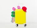 Suitcase isolated on white background Summer holidays. summer flip flops or slippers.Sandals beach.Red cap.Travel valise or bag. M Royalty Free Stock Photo