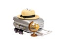 Suitcase isolated on white. Suitcase, sunglasses with toy plane, straw hat and globe in travel composition isolated on white Royalty Free Stock Photo