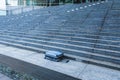 Suitcase left on a large stone staircase Royalty Free Stock Photo