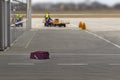 The suitcase lost by the airport staff lies on the floor. Concept of lost luggage. Royalty Free Stock Photo