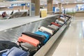 Suitcase or luggage with conveyor belt in the airport. Royalty Free Stock Photo