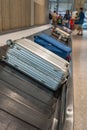 Suitcase or luggage on conveyor belt at airport baggage claim Royalty Free Stock Photo
