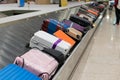 Suitcase or luggage with conveyor belt in the airport. Traverler waiting suitcase or luggage in arrival hall in airport.. Royalty Free Stock Photo