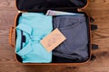Suitcase packed with neatly folded clothes. Royalty Free Stock Photo