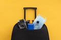 Suitcase packed for a vacation during coronavirus covid pandemic Royalty Free Stock Photo