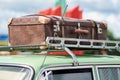 Suitcase on the roof of an old car Royalty Free Stock Photo