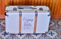 Suitcase with text enjoy the little things Royalty Free Stock Photo