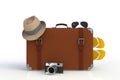 Suitcase of a traveler with  straw hat and retro film photo camera isolated on white background Royalty Free Stock Photo