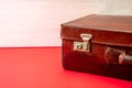 Suitcase vintage  old travel baggage on red floor  copy space Royalty Free Stock Photo