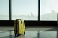 Suitcases in airport departure lounge, airplane in background, summer vacation concept, traveler suitcases in airport Royalty Free Stock Photo