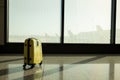 Suitcases in airport departure lounge, airplane in background, summer vacation concept, traveler suitcases in airport Royalty Free Stock Photo