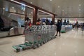 Suitcases or baggage on luggage conveyor belt in arrivals lounge of airport terminal. Selective focus. Luggage track at an airport